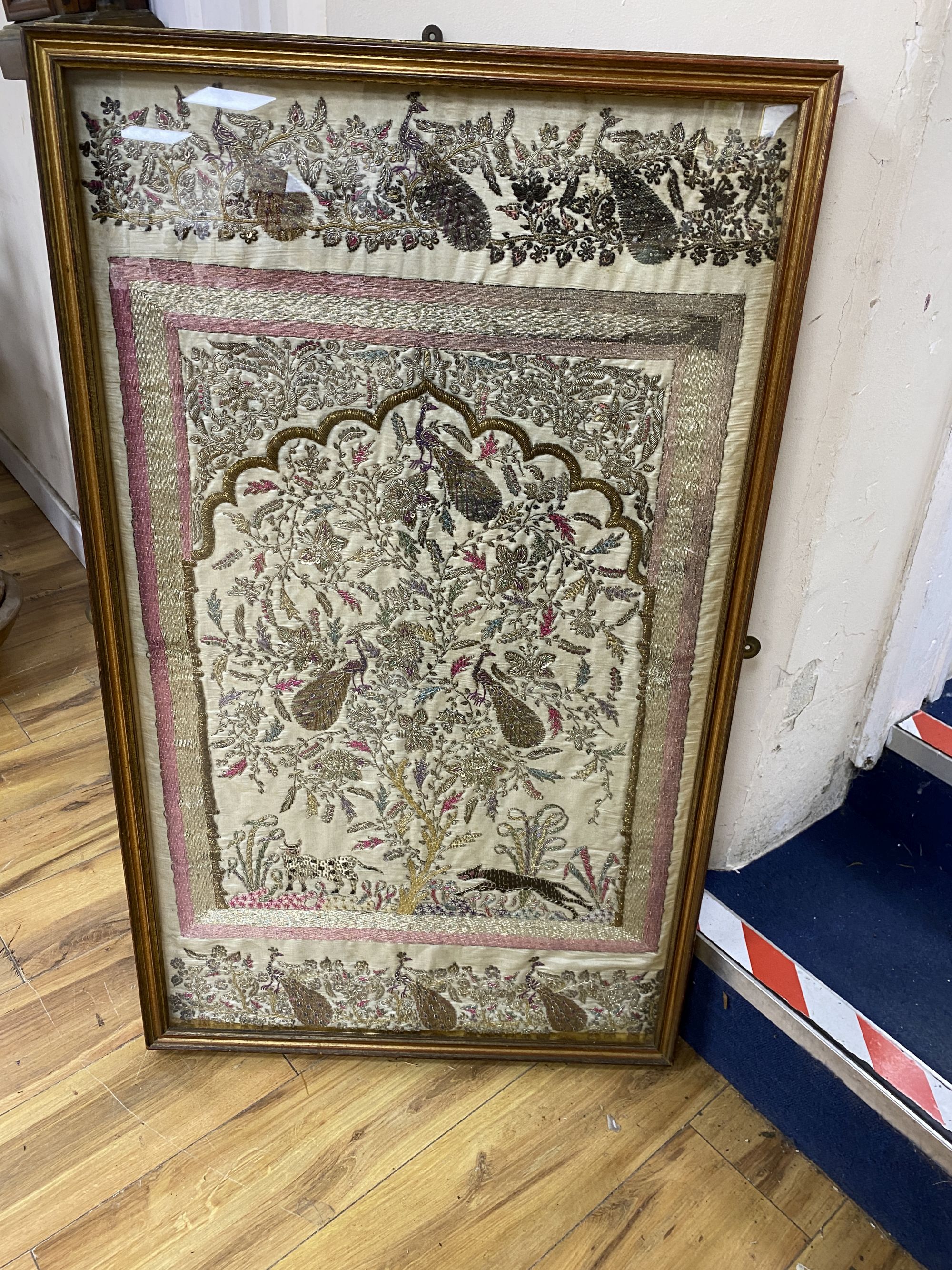 An Indian metal thread and sequin embroidered panel, 97 x 56cm, framed